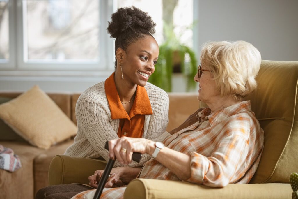 a woman taking care of an elderly lady